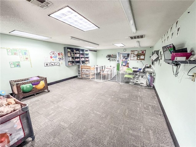 interior space featuring a textured ceiling and carpet floors