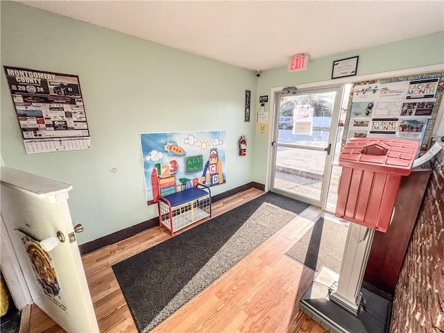 1201 S Willow St, Coffeyville, KS 67337 - foyer with wood finished floors and baseboards