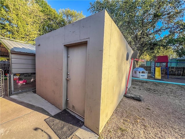 view of outbuilding featuring a playground