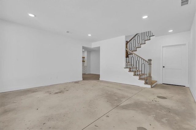 interior space with recessed lighting, visible vents, unfinished concrete flooring, and stairs