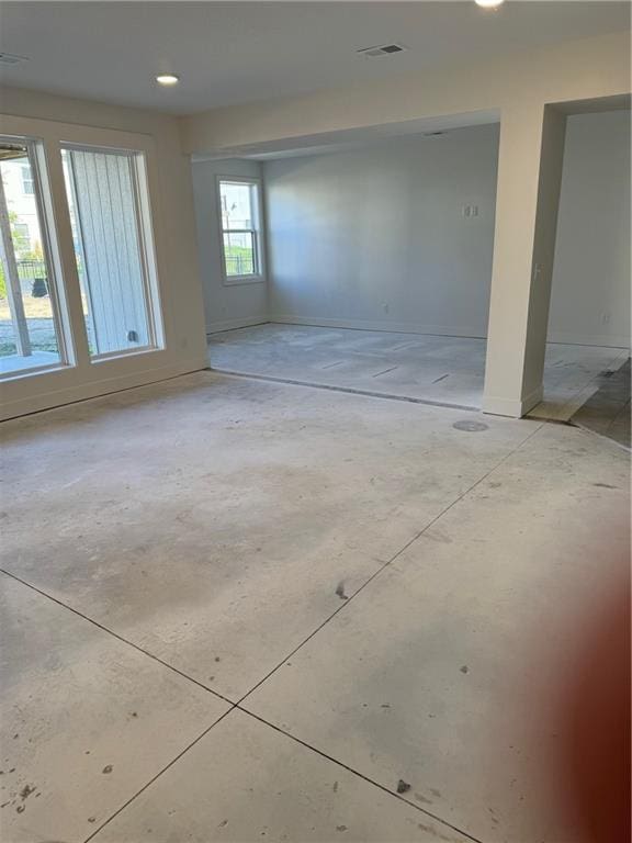 interior space with baseboards and visible vents