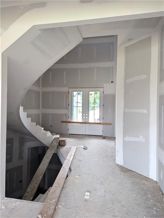 16928 Futura St, Overland Park, KS 66085 - unfurnished living room with french doors