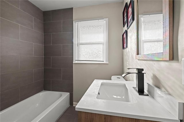 bathroom with vanity, separate shower and tub, and plenty of natural light