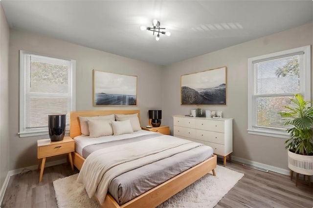 bedroom with wood-type flooring