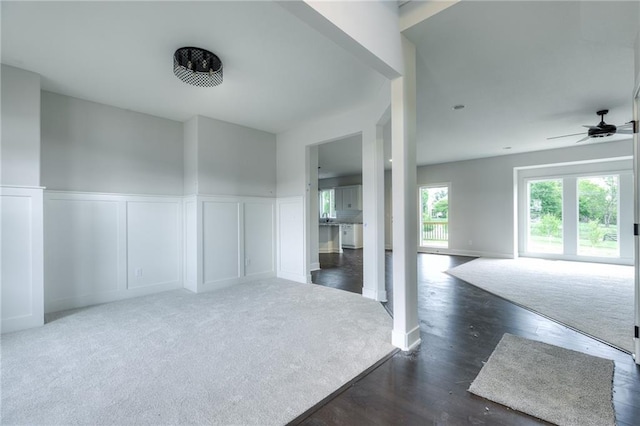 spare room with ceiling fan and dark hardwood / wood-style floors