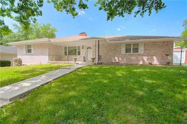 ranch-style house with covered porch and a front yard