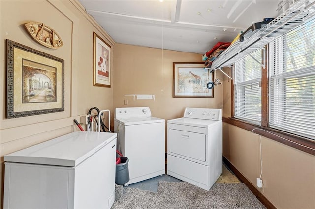 clothes washing area featuring washing machine and dryer