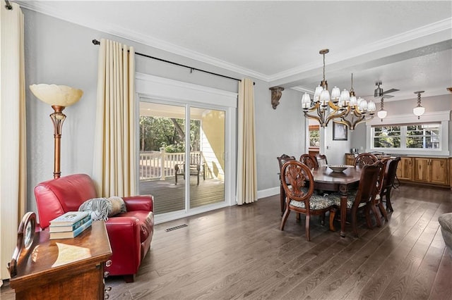 dining space with ceiling fan with notable chandelier, crown molding, and dark hardwood / wood-style flooring