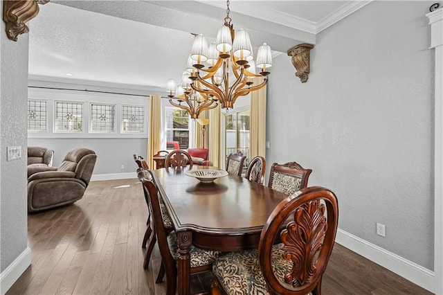 dining area featuring crown molding, an inviting chandelier, and wood-type flooring