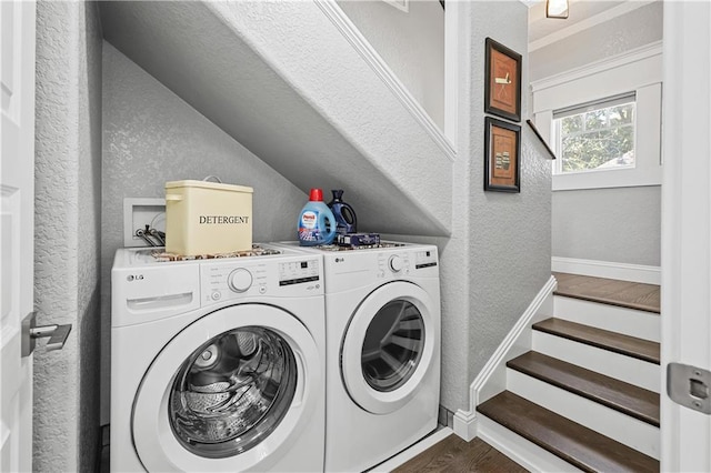 laundry area featuring dark wood-type flooring and washing machine and clothes dryer