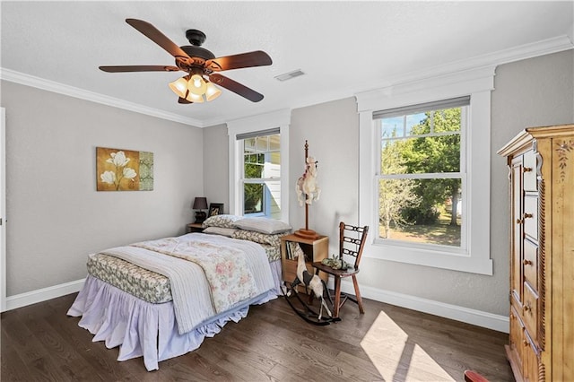 bedroom with multiple windows, ceiling fan, and dark hardwood / wood-style flooring