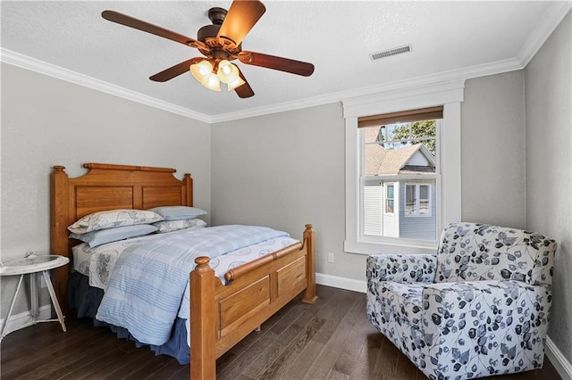 bedroom featuring ornamental molding, dark hardwood / wood-style flooring, and ceiling fan