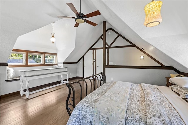 bedroom featuring lofted ceiling and wood-type flooring