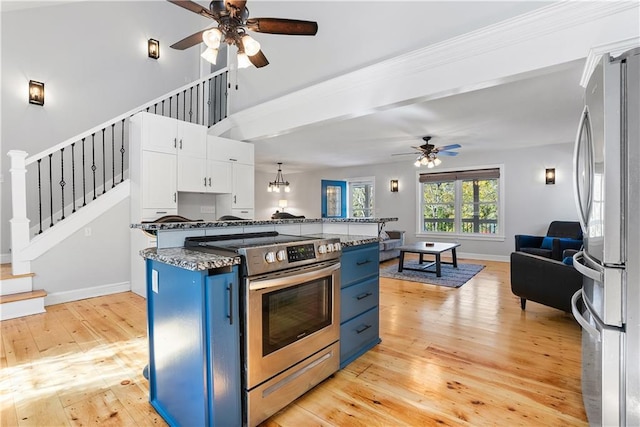 kitchen featuring appliances with stainless steel finishes, light wood-type flooring, white cabinetry, ceiling fan, and blue cabinetry