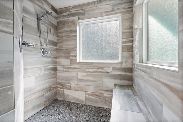 bathroom with tiled shower