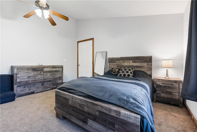 bedroom with lofted ceiling, carpet, and ceiling fan