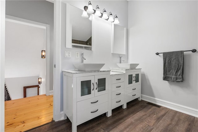 bathroom with vanity and hardwood / wood-style floors