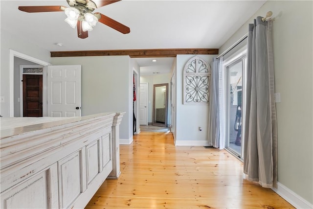 interior space with baseboards and light wood-style floors