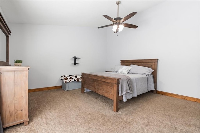 bedroom with a ceiling fan, light colored carpet, and baseboards