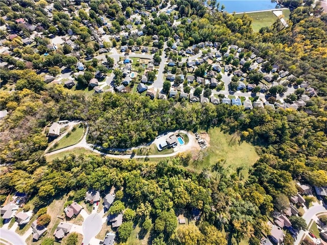 birds eye view of property with a residential view