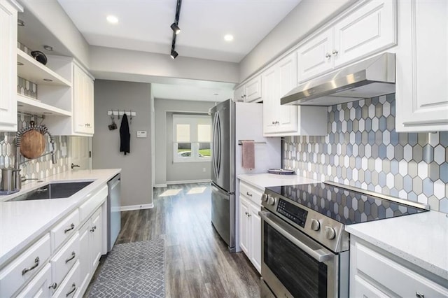 kitchen with decorative backsplash, dark hardwood / wood-style flooring, stainless steel appliances, sink, and white cabinetry