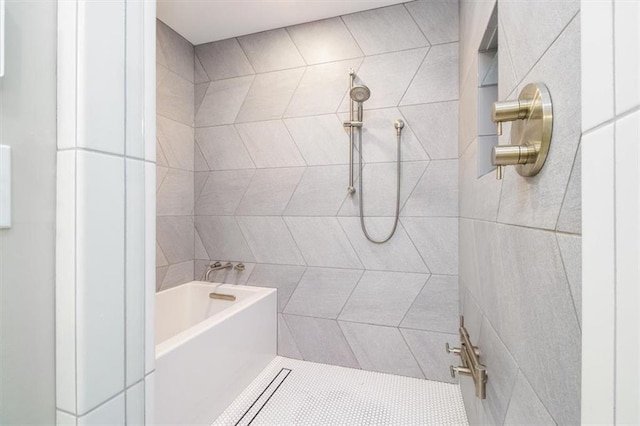 bathroom featuring shower with separate bathtub