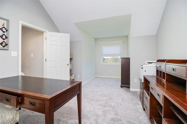 office space with light carpet and lofted ceiling