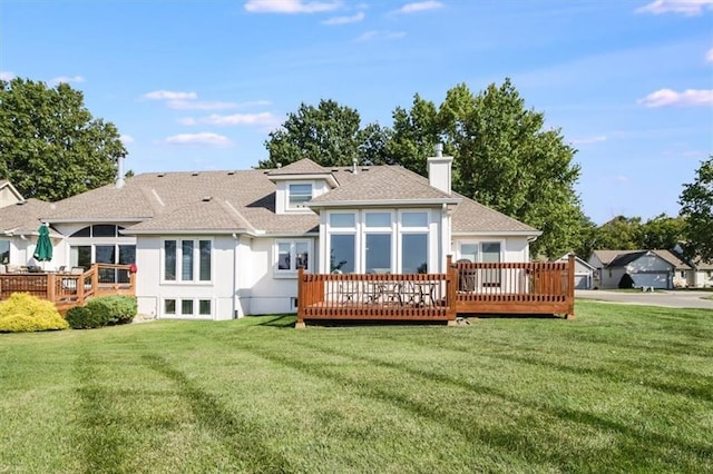 back of house featuring a yard and a deck