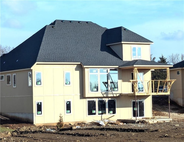 rear view of house with a balcony