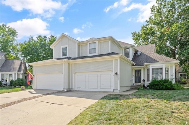 view of front of house featuring a front yard and a garage