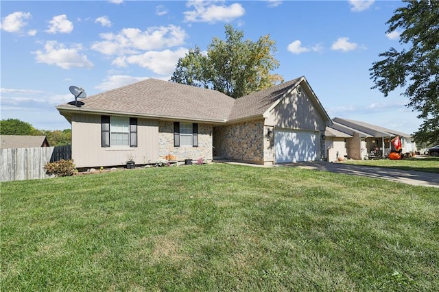 view of front of house featuring a garage and a front lawn