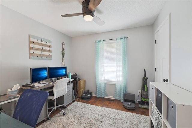 office area featuring dark hardwood / wood-style floors and ceiling fan