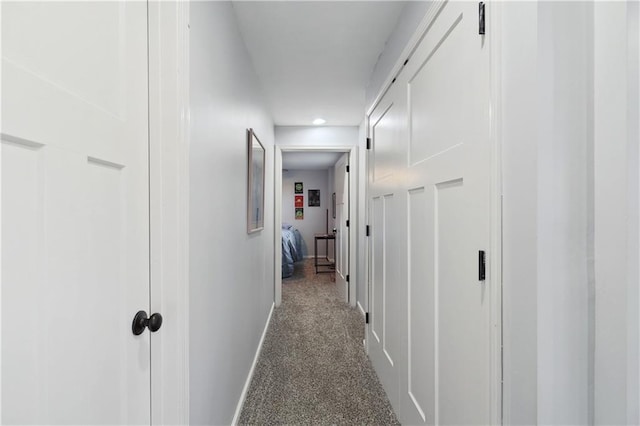 hallway featuring carpet flooring