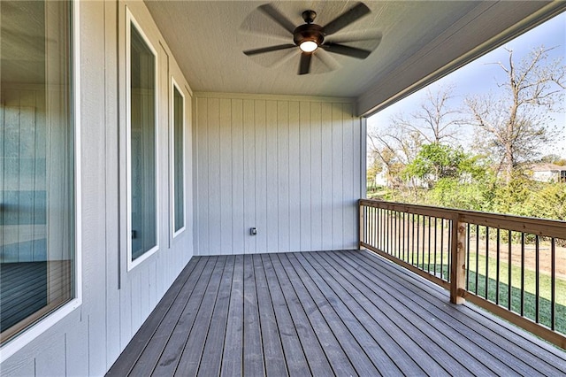 wooden terrace featuring ceiling fan