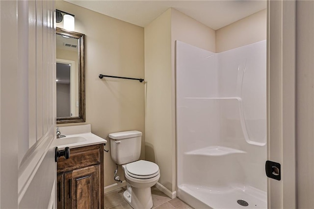 bathroom with tile patterned flooring, a shower, vanity, and toilet