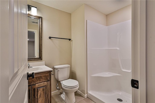 bathroom featuring toilet, a walk in shower, vanity, tile patterned flooring, and visible vents