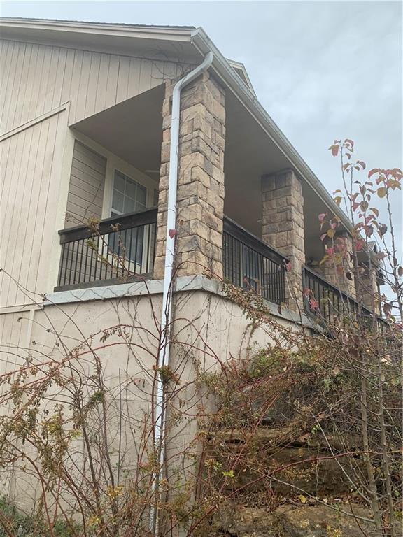 view of side of property featuring a balcony