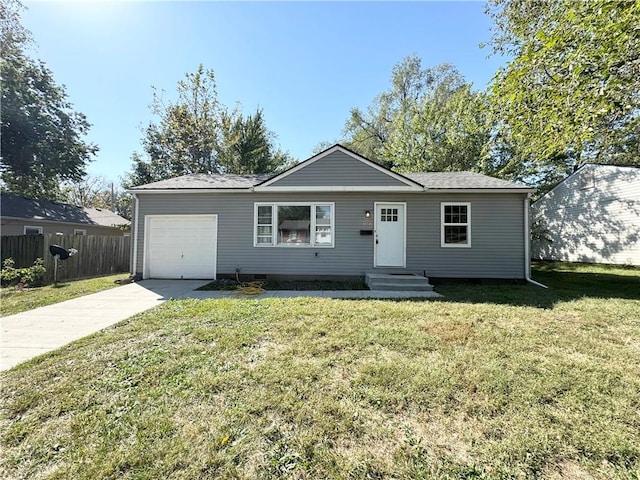 single story home featuring a garage and a front lawn