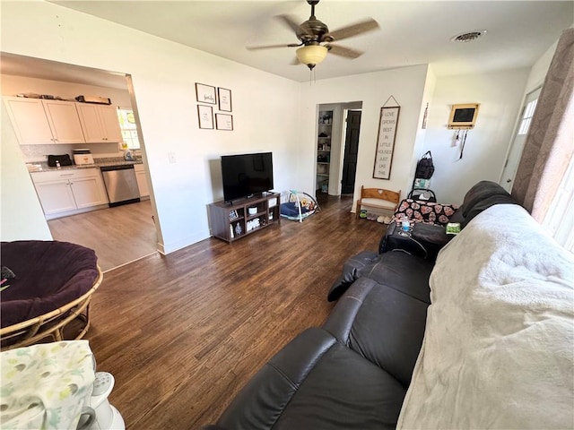 living room with ceiling fan and wood-type flooring