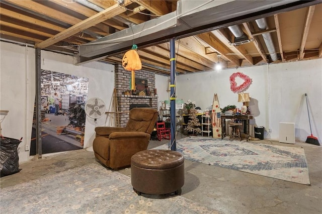 basement with a brick fireplace