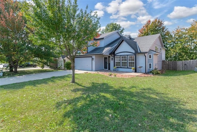 view of front of home featuring a garage and a front lawn