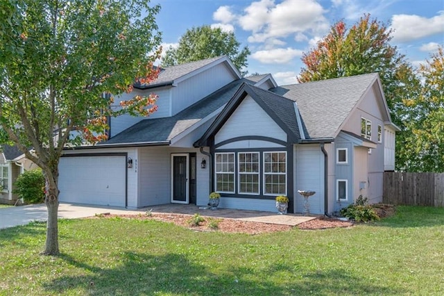 view of front property with a front yard and a garage