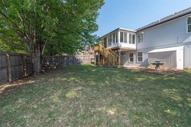 view of yard with a sunroom