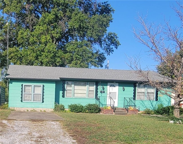 ranch-style home with a front yard