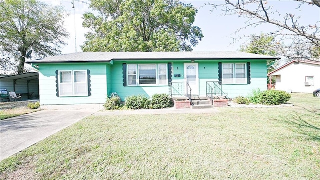 ranch-style home featuring a front yard and a carport