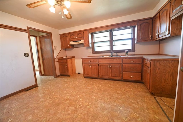 kitchen with ceiling fan and sink