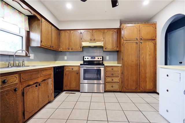 kitchen featuring stainless steel electric range, ceiling fan, light tile patterned floors, dishwasher, and sink