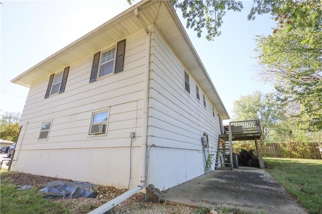 view of side of property with a deck