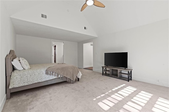 carpeted bedroom with ceiling fan and high vaulted ceiling