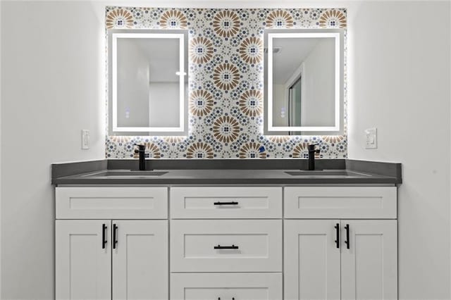 bathroom featuring vanity and backsplash